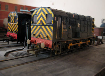 A pair of 08's share the fuelling point on the depot.